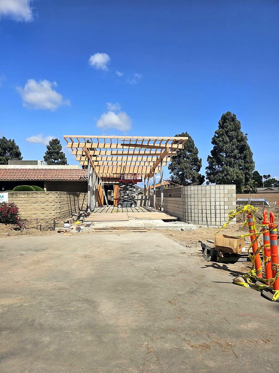 Timber framing rising over the future museum entrance.